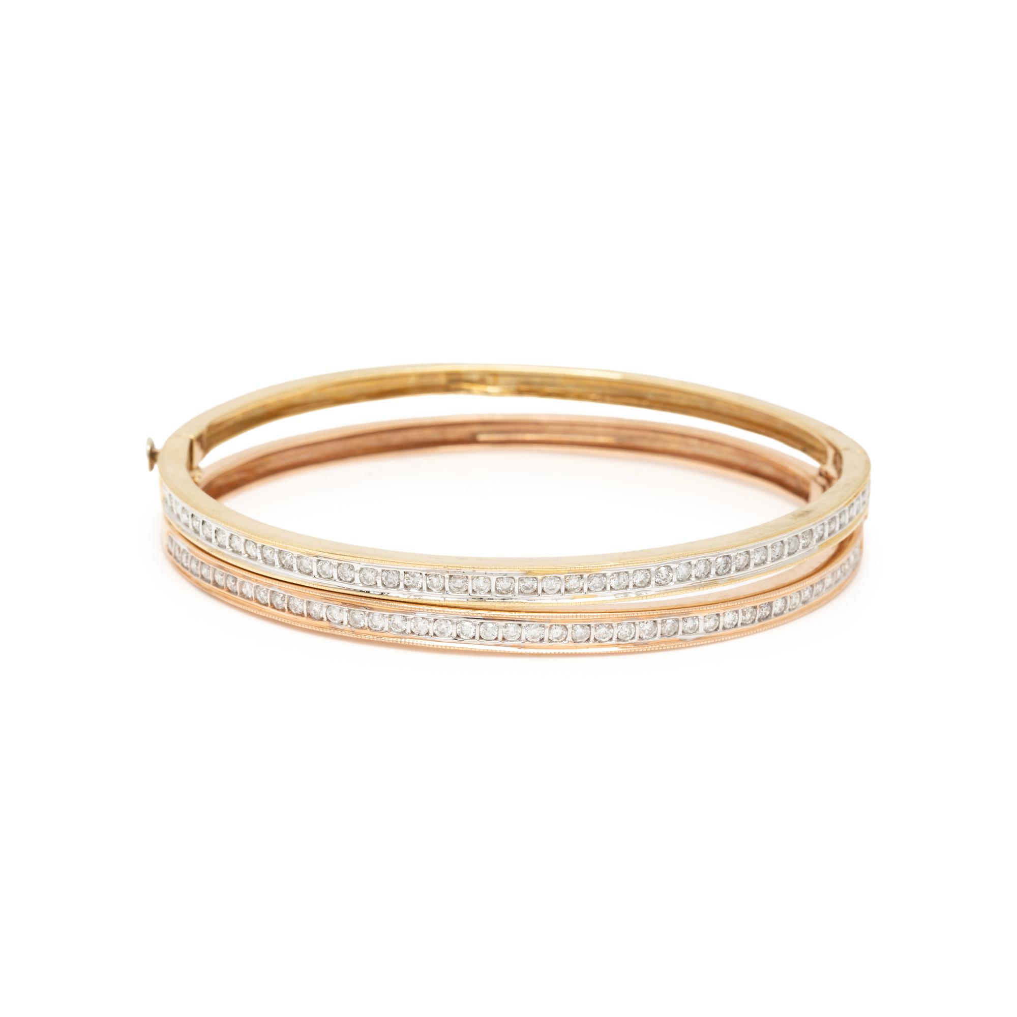 PAIR OF GOLD AND DIAMOND BANGLES