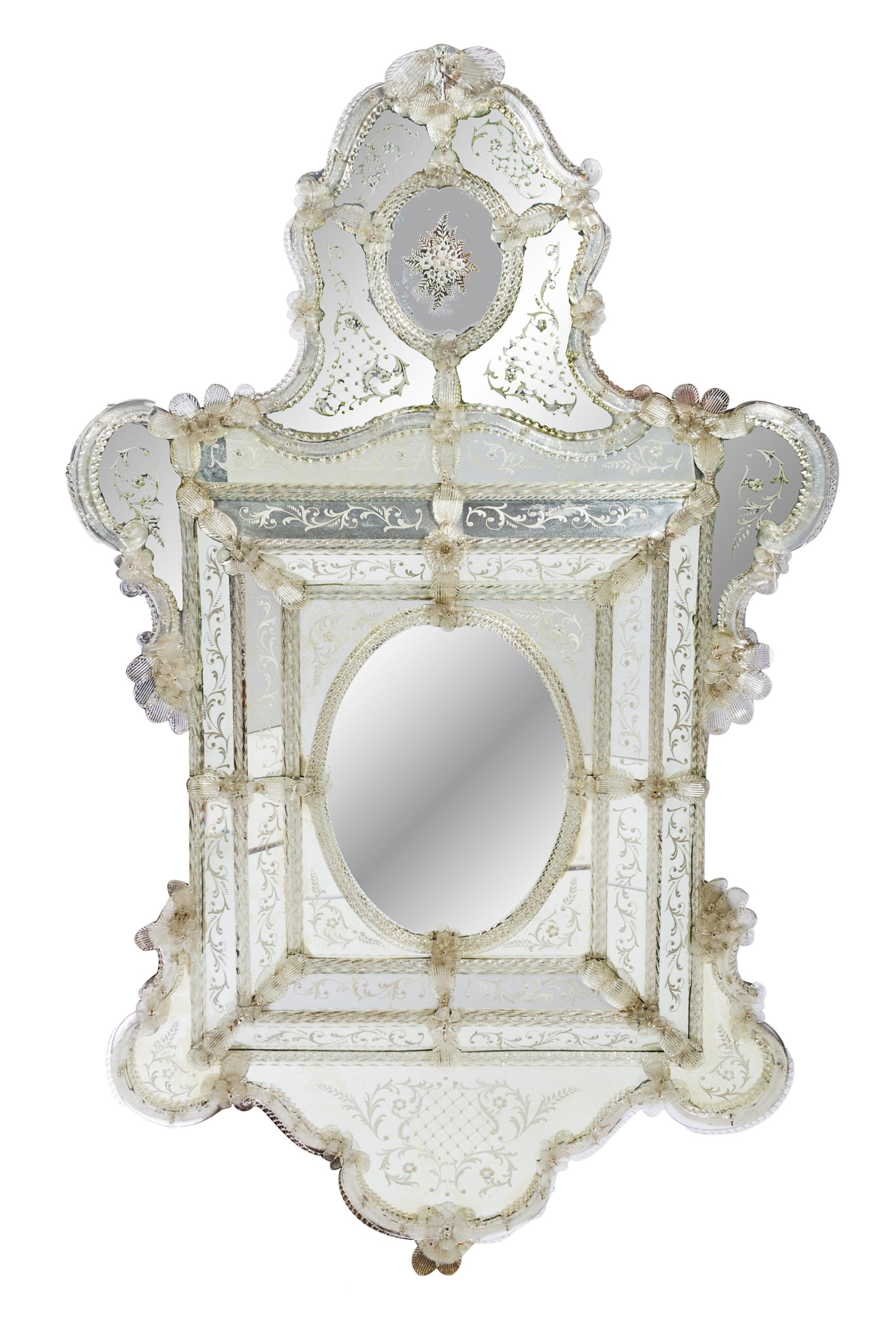 A Venetian Glass Mirror Height 66 1/4 inches.