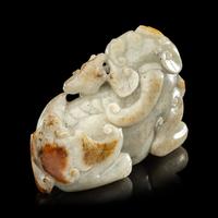 A Chinese Russet and Greyish Celadon Jade Figure of a Recumbent Qilin 青玉麒麟