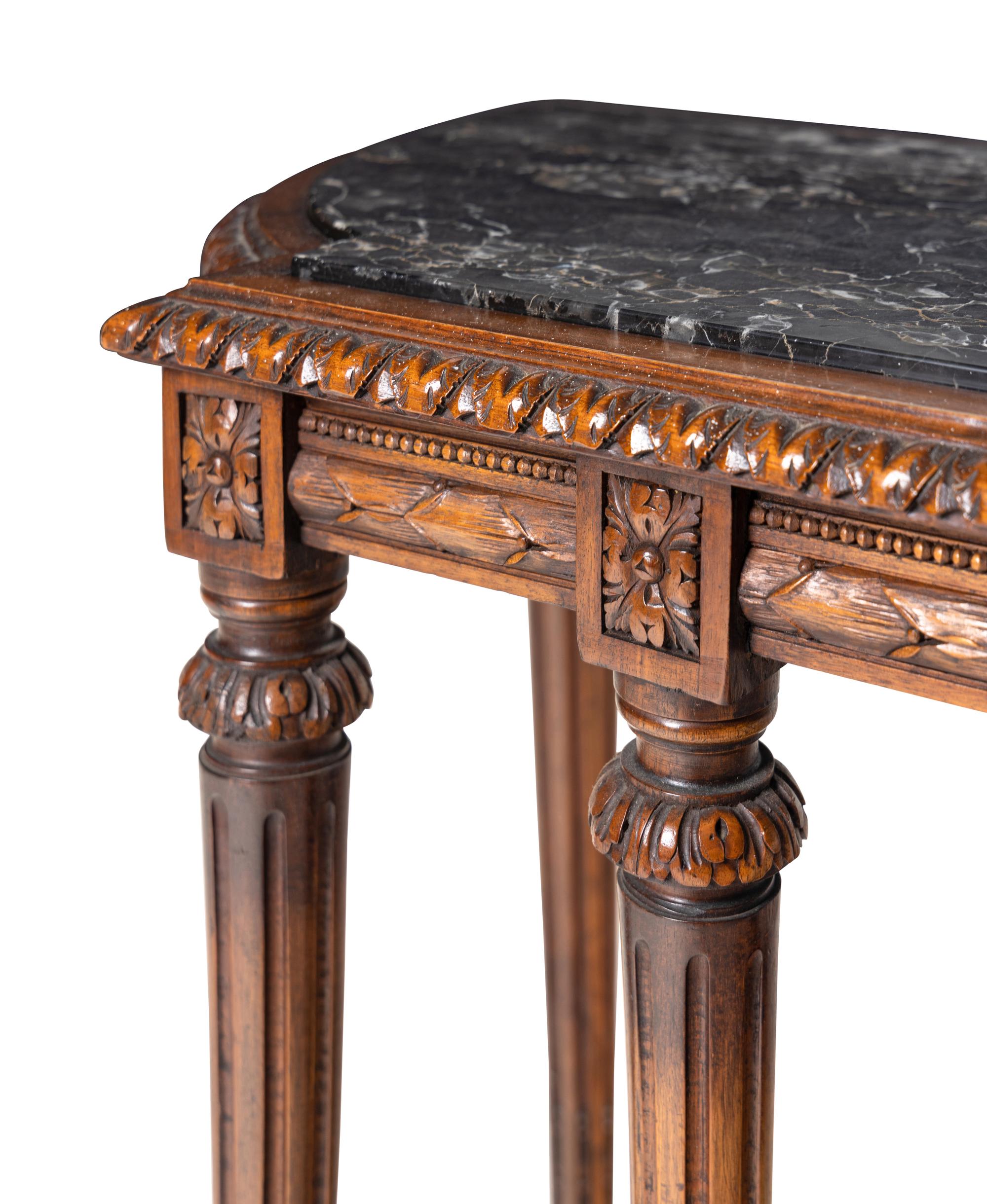 A Louis XVI Style Carved Walnut Marble-Top Console Table