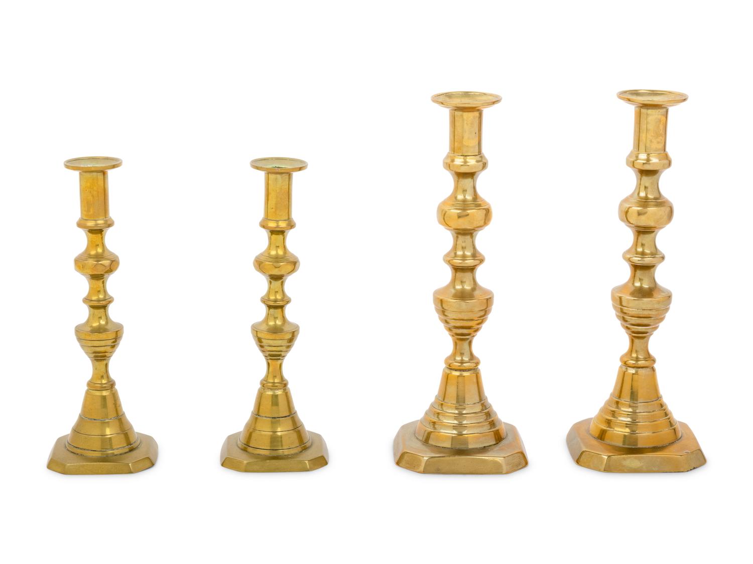 Four English Diamond Pattern Brass Candlesticks