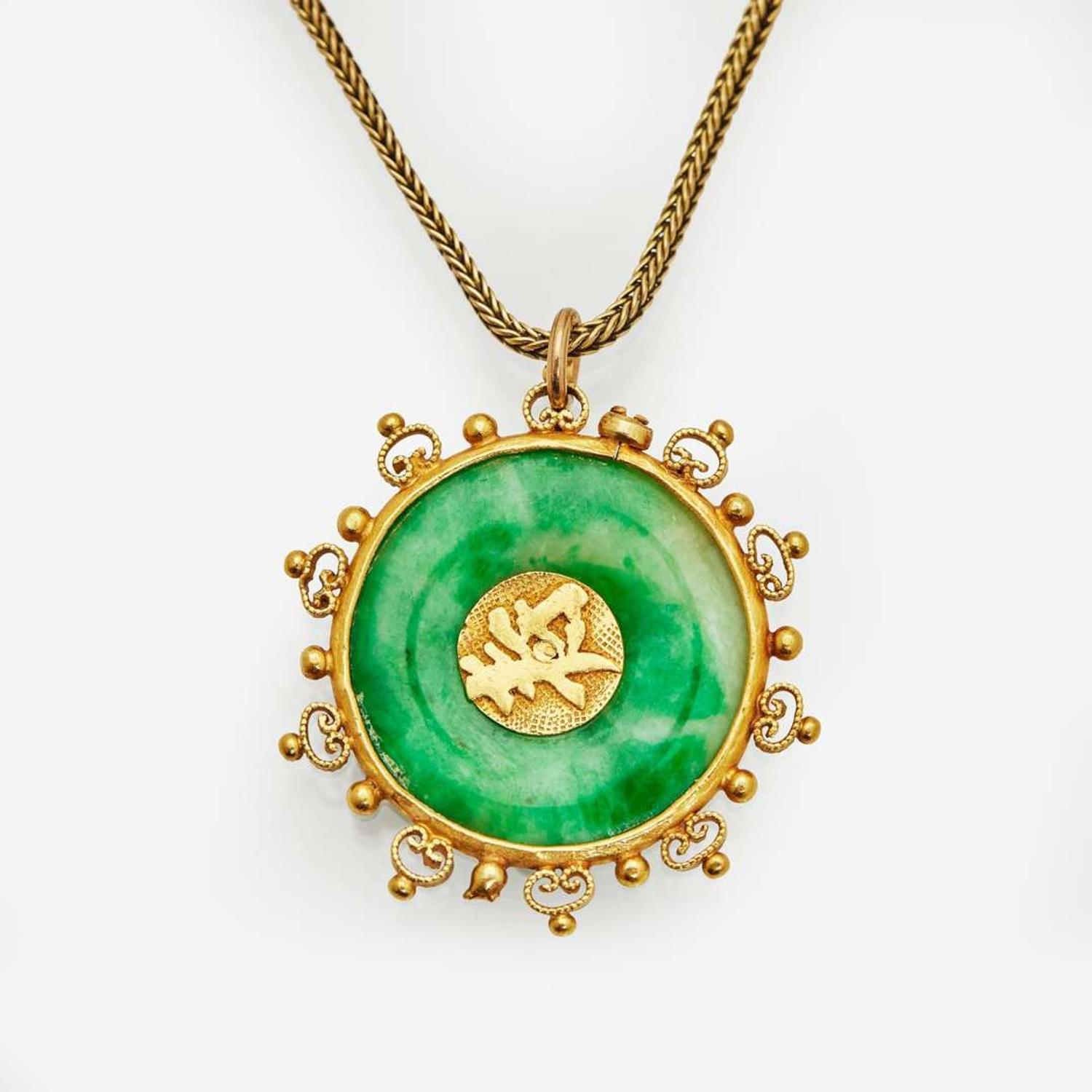 A 22K Yellow Gold and Jadeite Pendant on a 14K Yellow Gold Chain