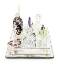 A Collection of Eleven Glass Perfume Bottles and a Mirrored Glass Tray