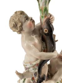 A Pair of Meissen Porcelain Figural Candlesticks