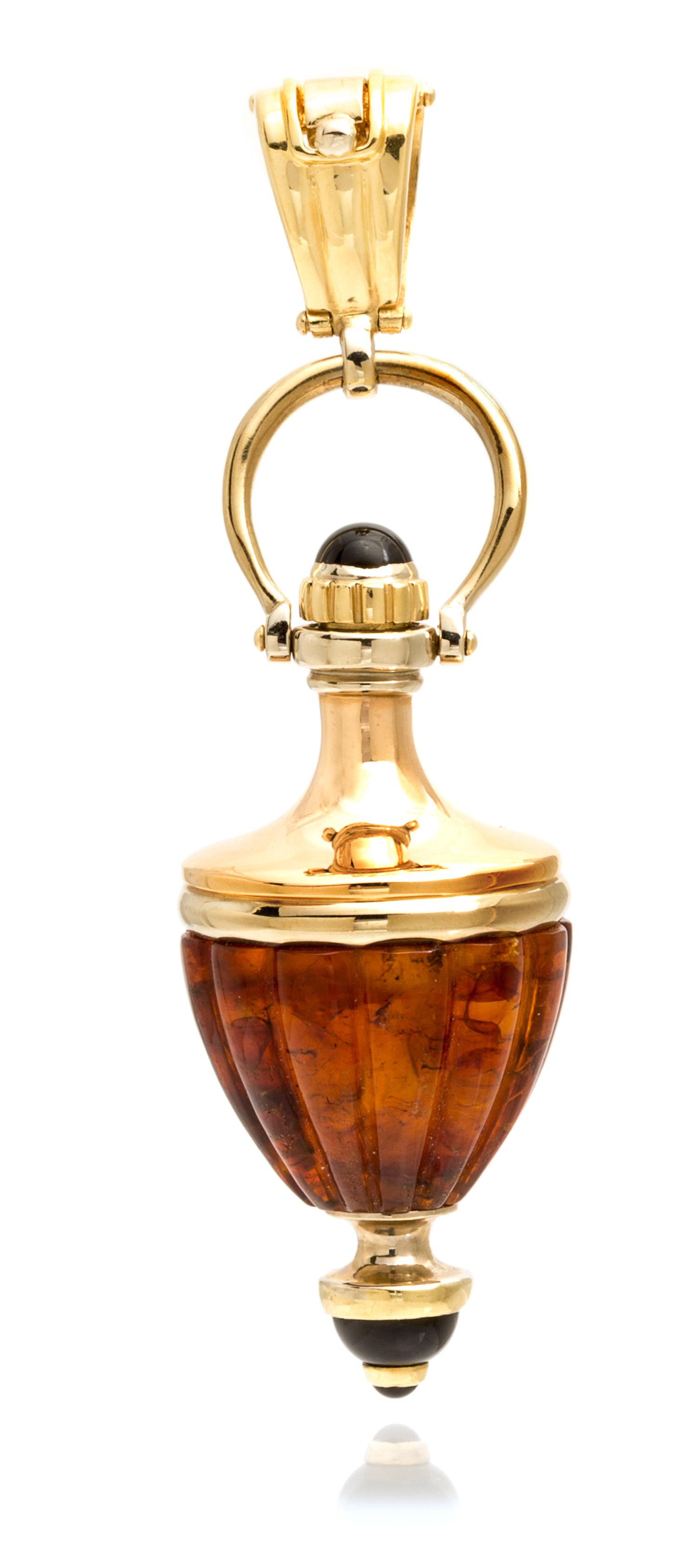 An 18 Karat Yellow Gold, Onyx and Amber Perfume Bottle Pendant, Italian, 19.90 dwts.