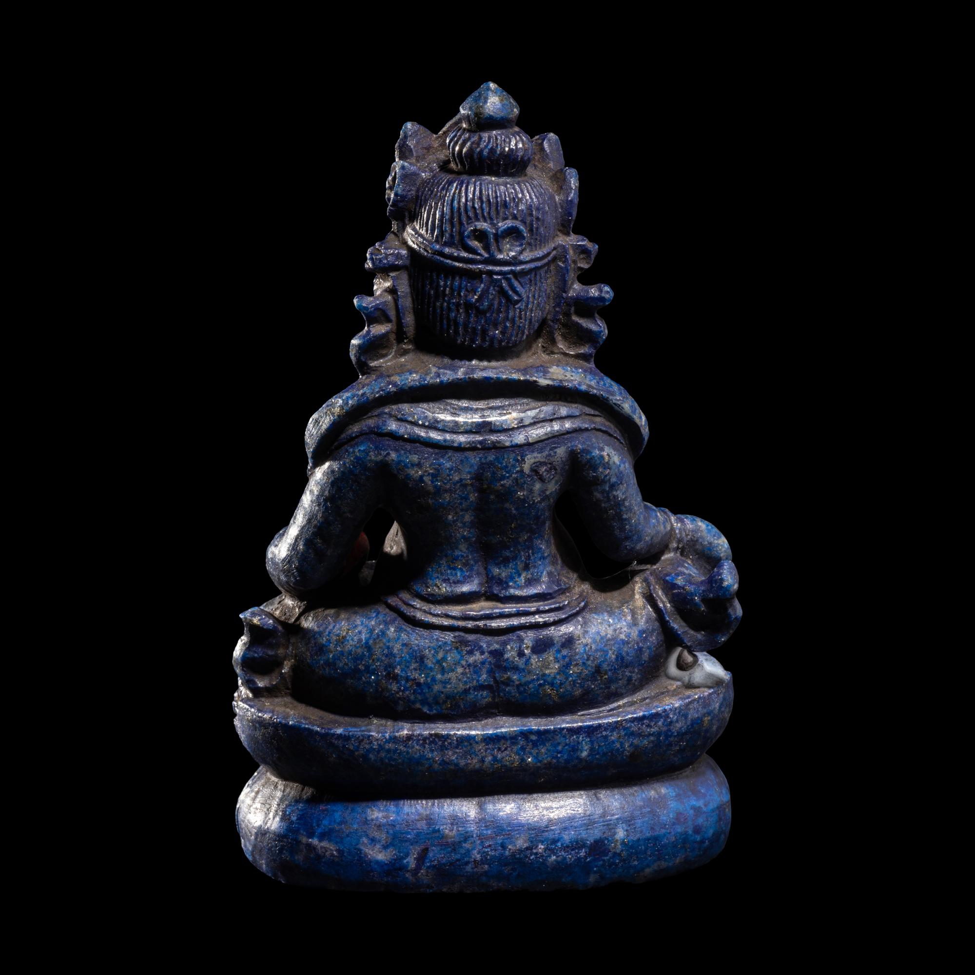 A Sino-Tibetan Carved Lapis Lazuli Figure of Jambhalā