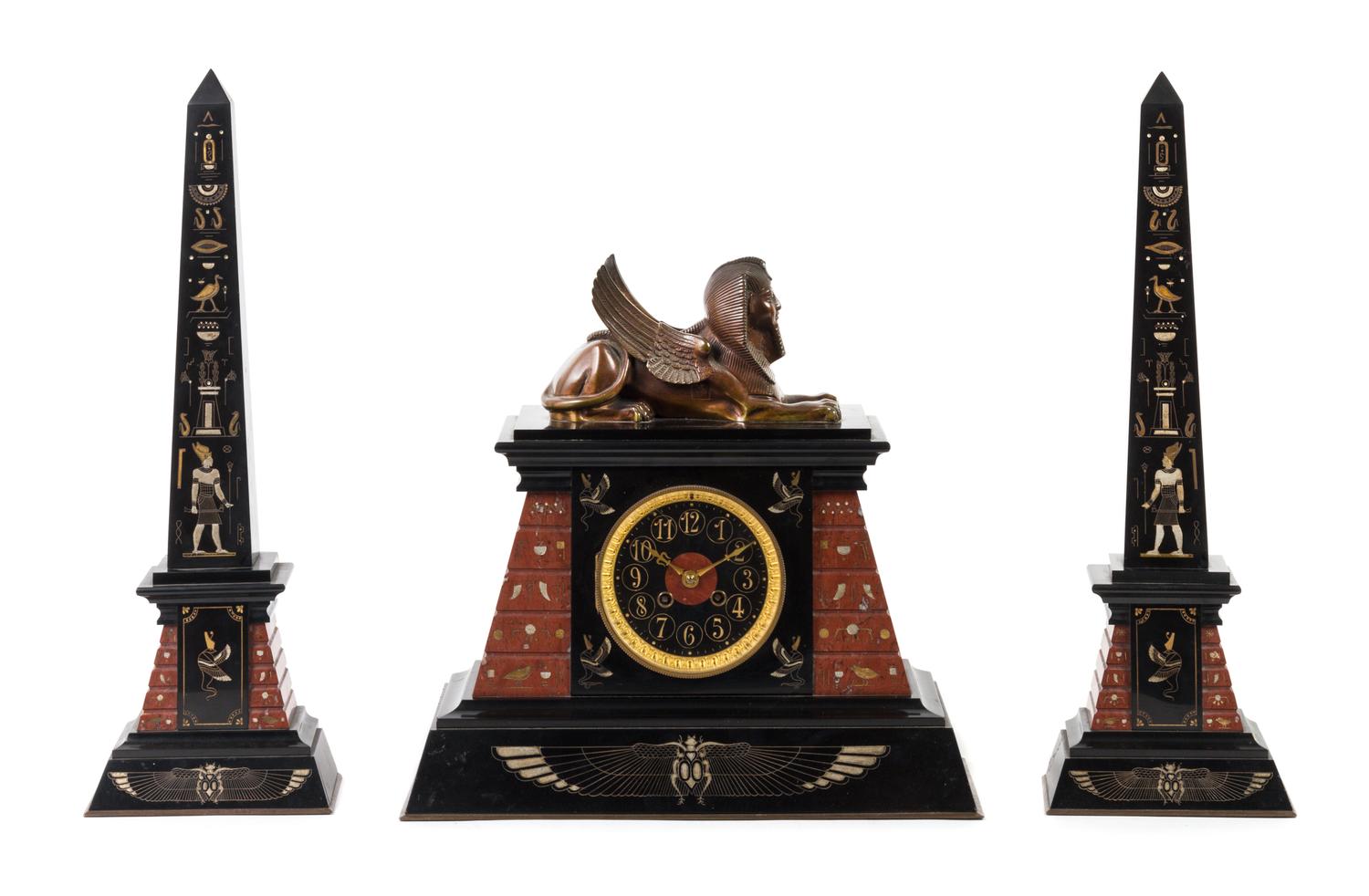 A French Egyptian Revival Three-Piece Clock Garniture Height of obelisk 20 1/4 inches. — 19TH/20TH CENTURY