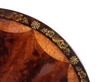 A Classical Parcel Gilt, Stencil Decorated, Carved and Inlaid Mahogany Tilt-Top Claw-Foot Breakfast Table