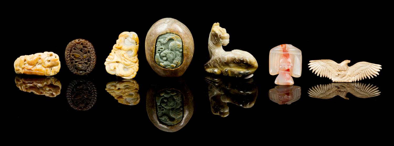Seven Carved Hardstone Toggles Height of largest 1 3/4 x width 2 1/4 x depth 3 1/4 inches.