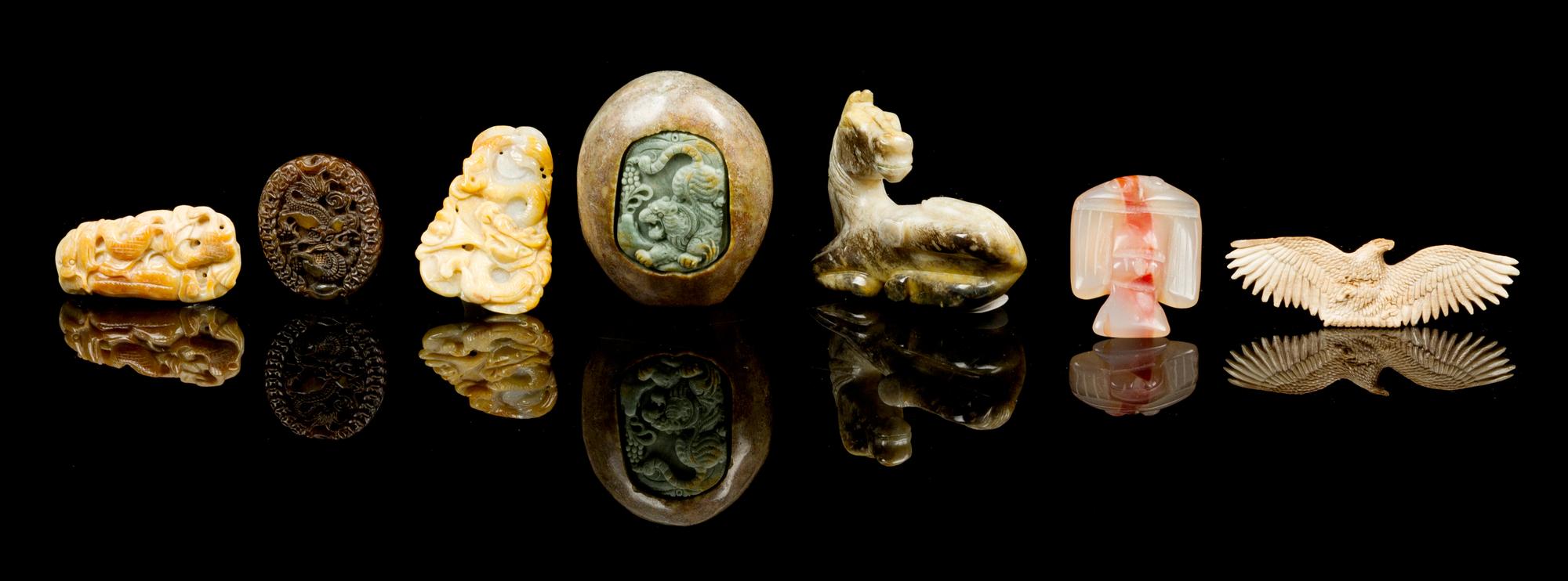 Seven Carved Hardstone Toggles Height of largest 1 3/4 x width 2 1/4 x depth 3 1/4 inches.