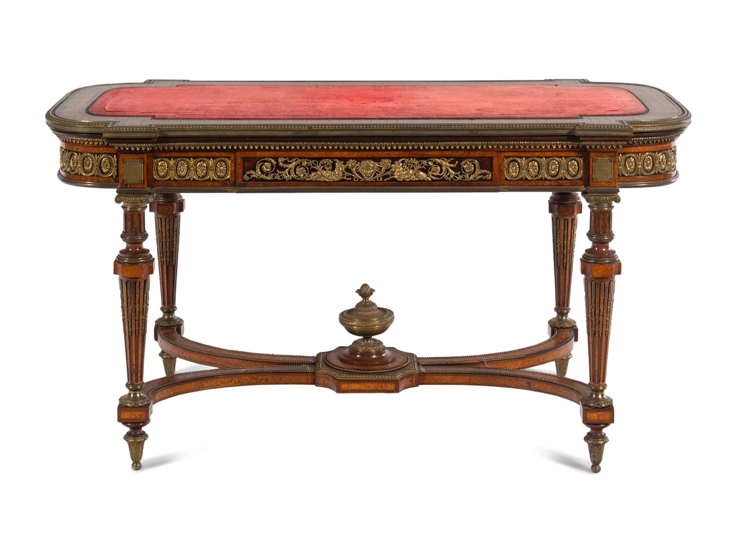 A Napoleon III Velvet-Inset and Gilt Bronze Mounted Amboyna Center Table