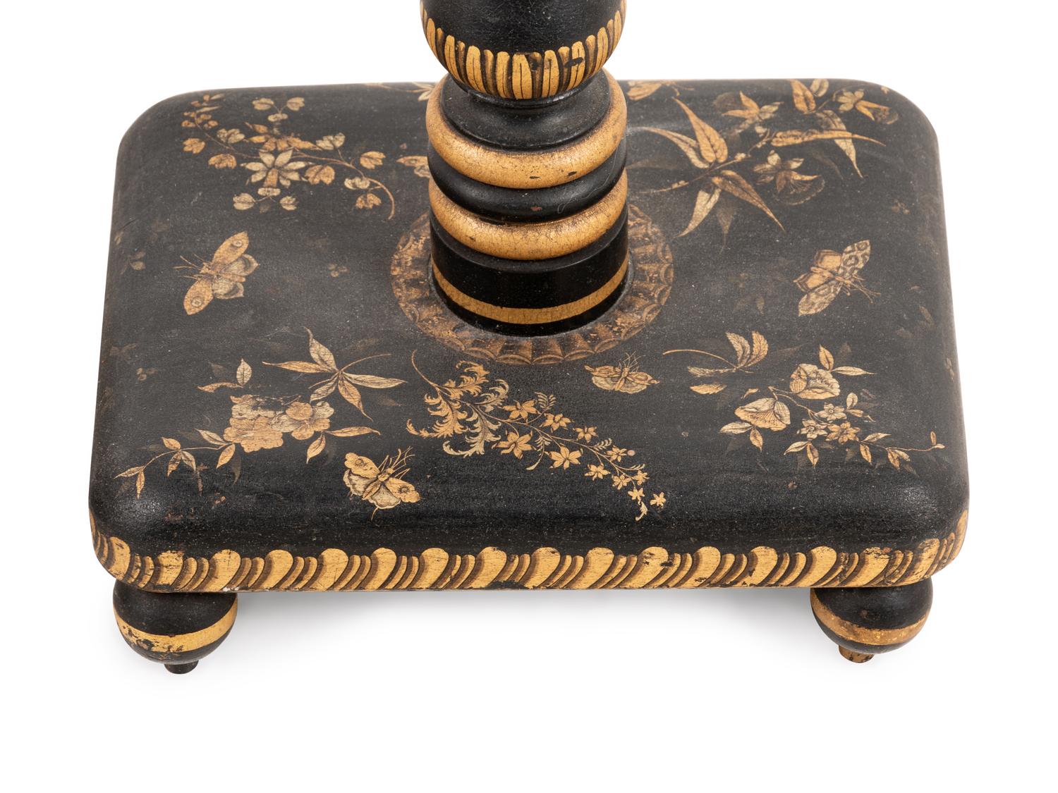 A Pair of Regency Style Parcel Gilt and Ebonized Floor Lamps