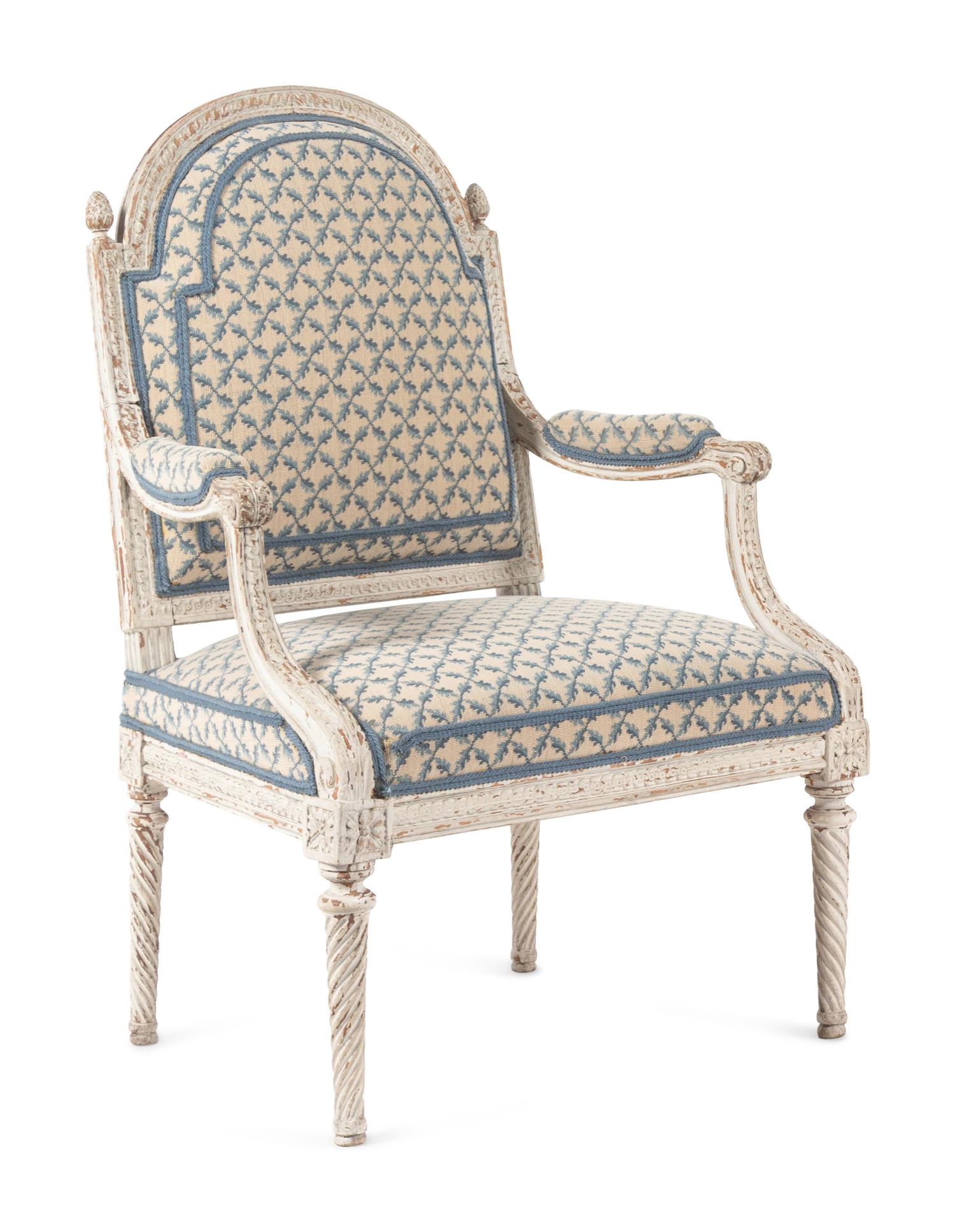 A Pair of Louis XVI Provincial White-Painted Fauteuils