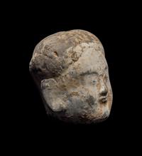 A Chinese Pottery Head of an Attendant