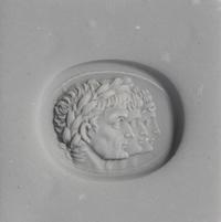 A Neoclassical Carnelian and Gold Finger Ring with a Roman Triumvir