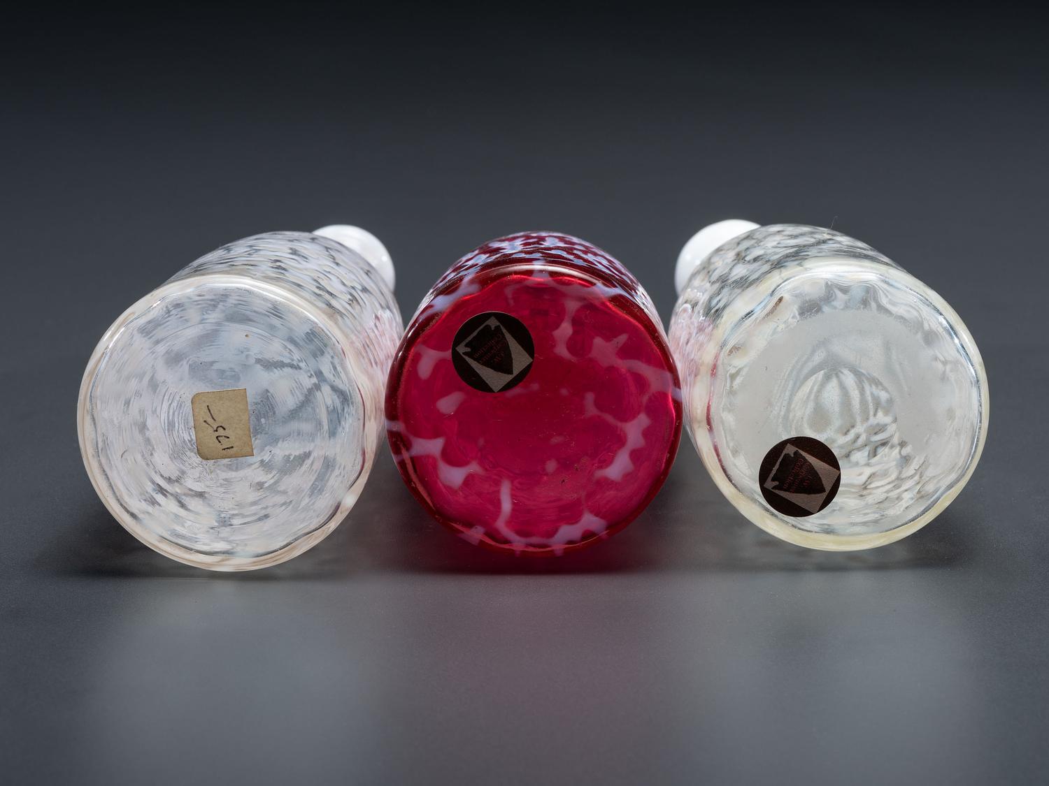 Three Coral Opalescent Glass Barber Bottles