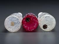 Three Coral Opalescent Glass Barber Bottles