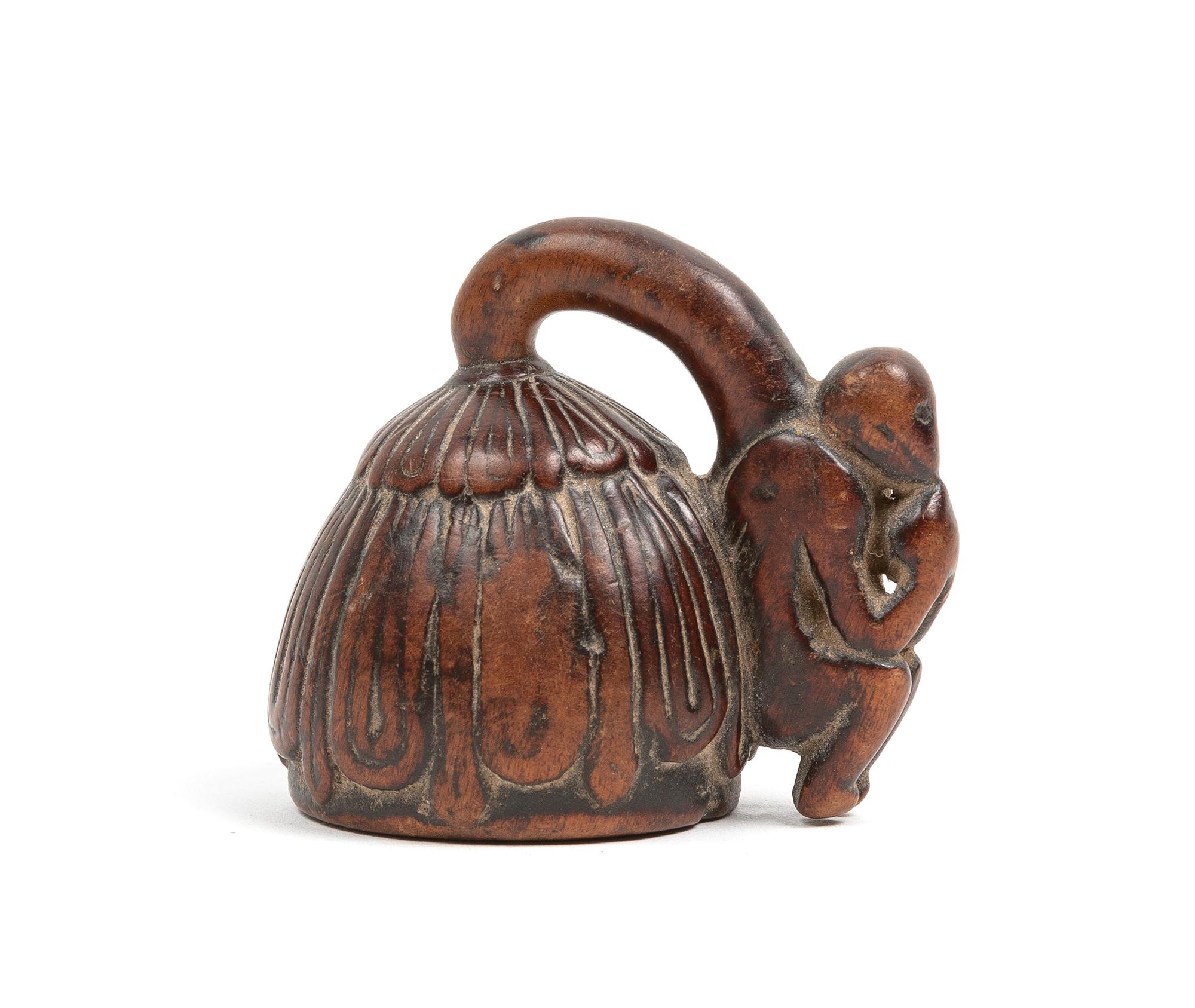 A Japanese Carved Wood Model of a Lotus Bud Length 2 1/2 inches. — 19TH CENTURY