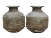 A Pair of Large Thai Hammered Metal Unrs — 20TH CENTURY