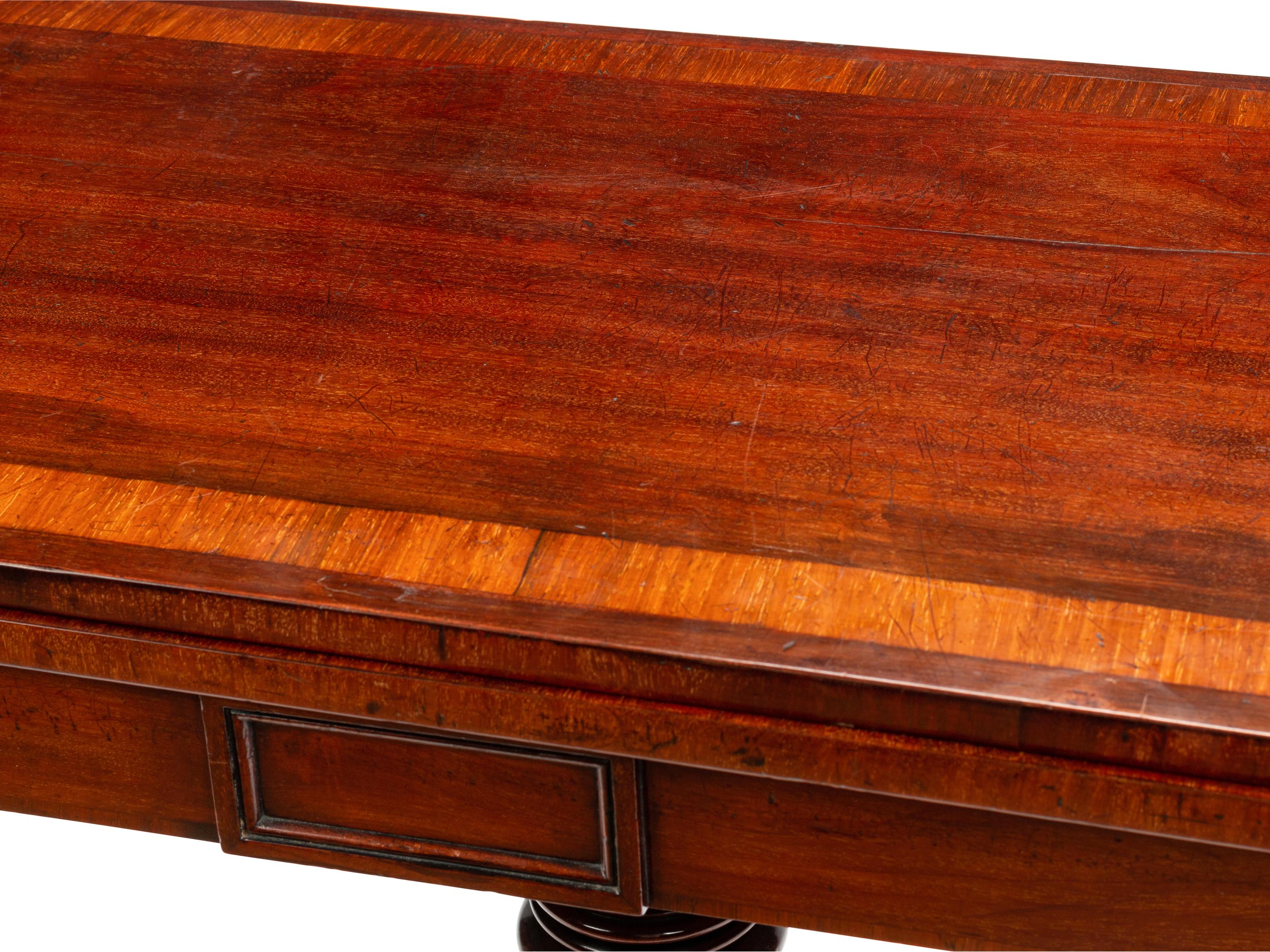 A Regency Crossbanded Mahogany Flip-Top Table