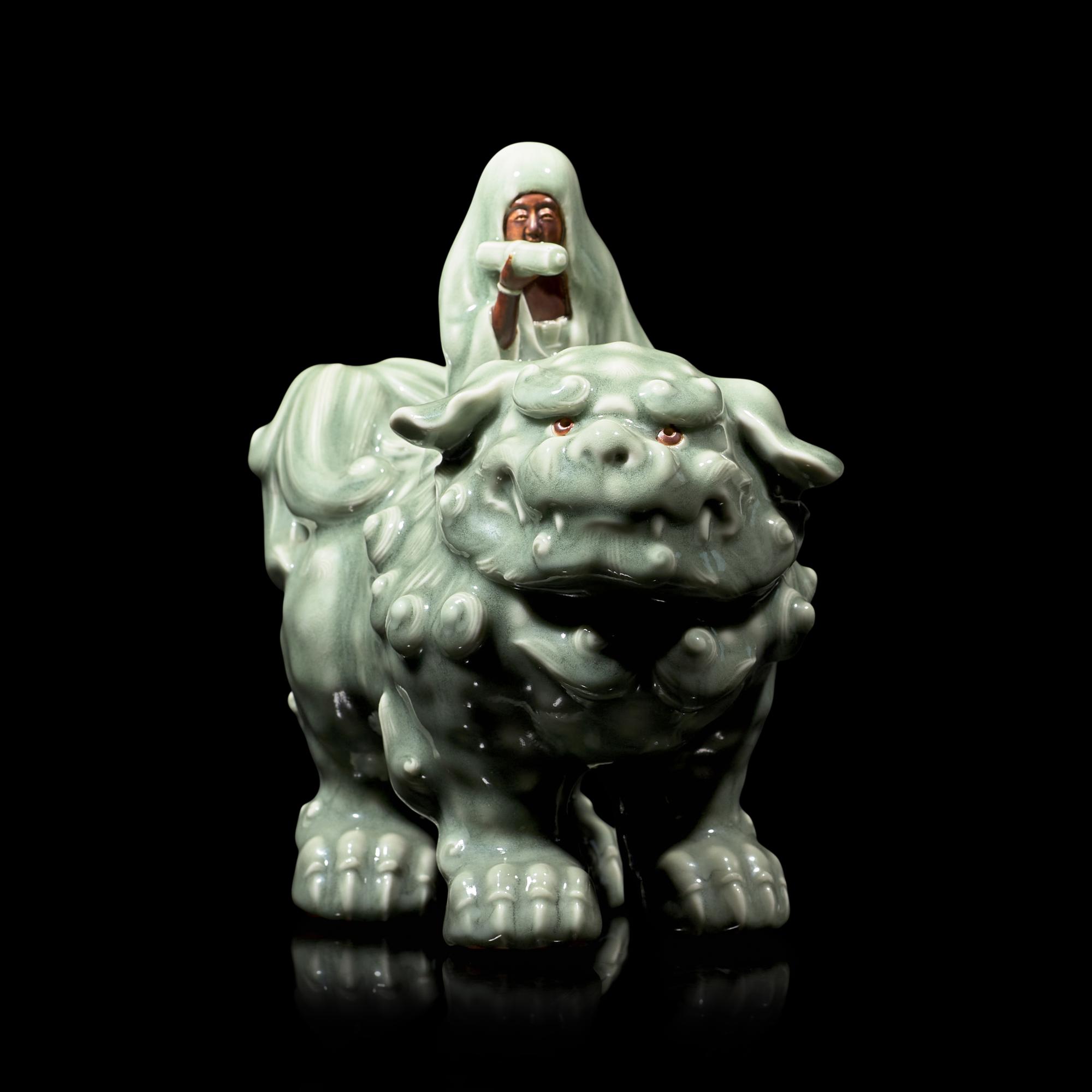 A Japanese Celadon-Glazed Monju on Lion, Impressed Seal Makuzu