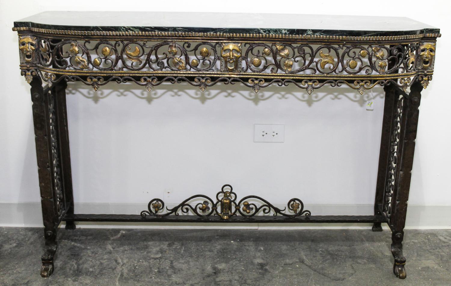 An Art Deco Style Wrought Iron and Marble Console Table, attributed to Oscar Bach Height 32 1/2 x width 49 1/2 x depth 16 inches.