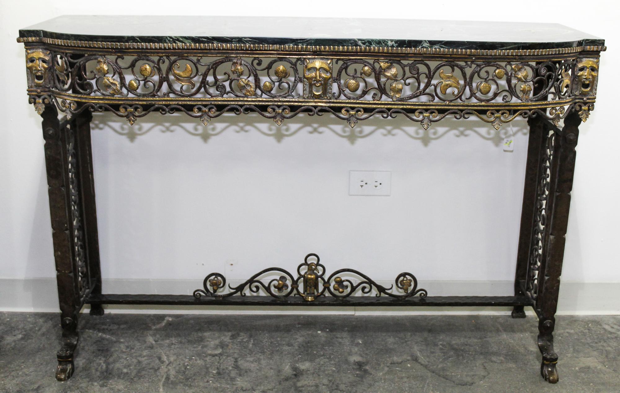 An Art Deco Style Wrought Iron and Marble Console Table, attributed to Oscar Bach Height 32 1/2 x width 49 1/2 x depth 16 inches.