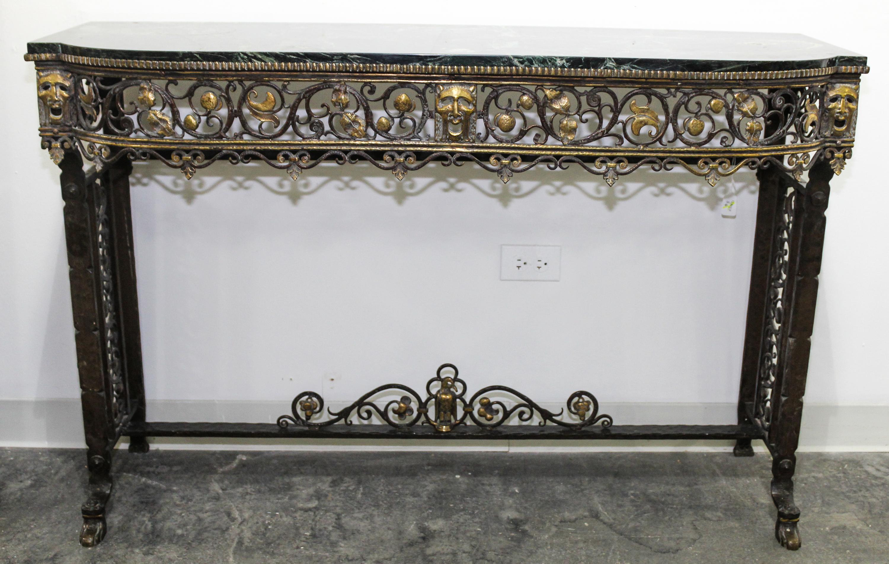 An Art Deco Style Wrought Iron and Marble Console Table, attributed to Oscar Bach Height 32 1/2 x width 49 1/2 x depth 16 inches.
