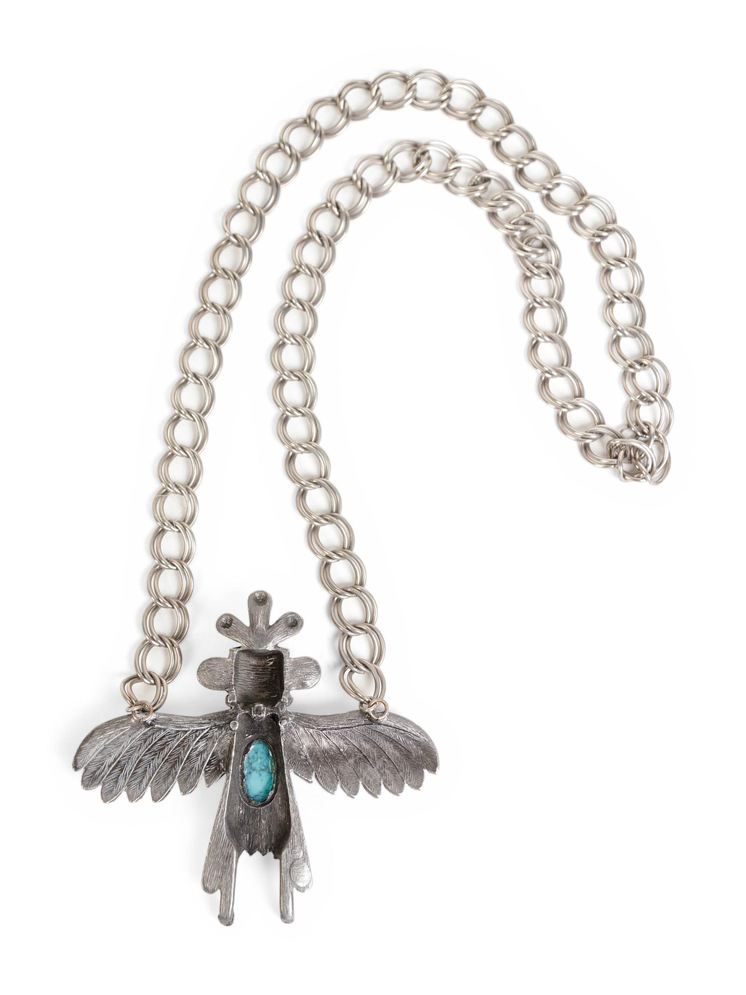 A Silver and Turquoise Pendant