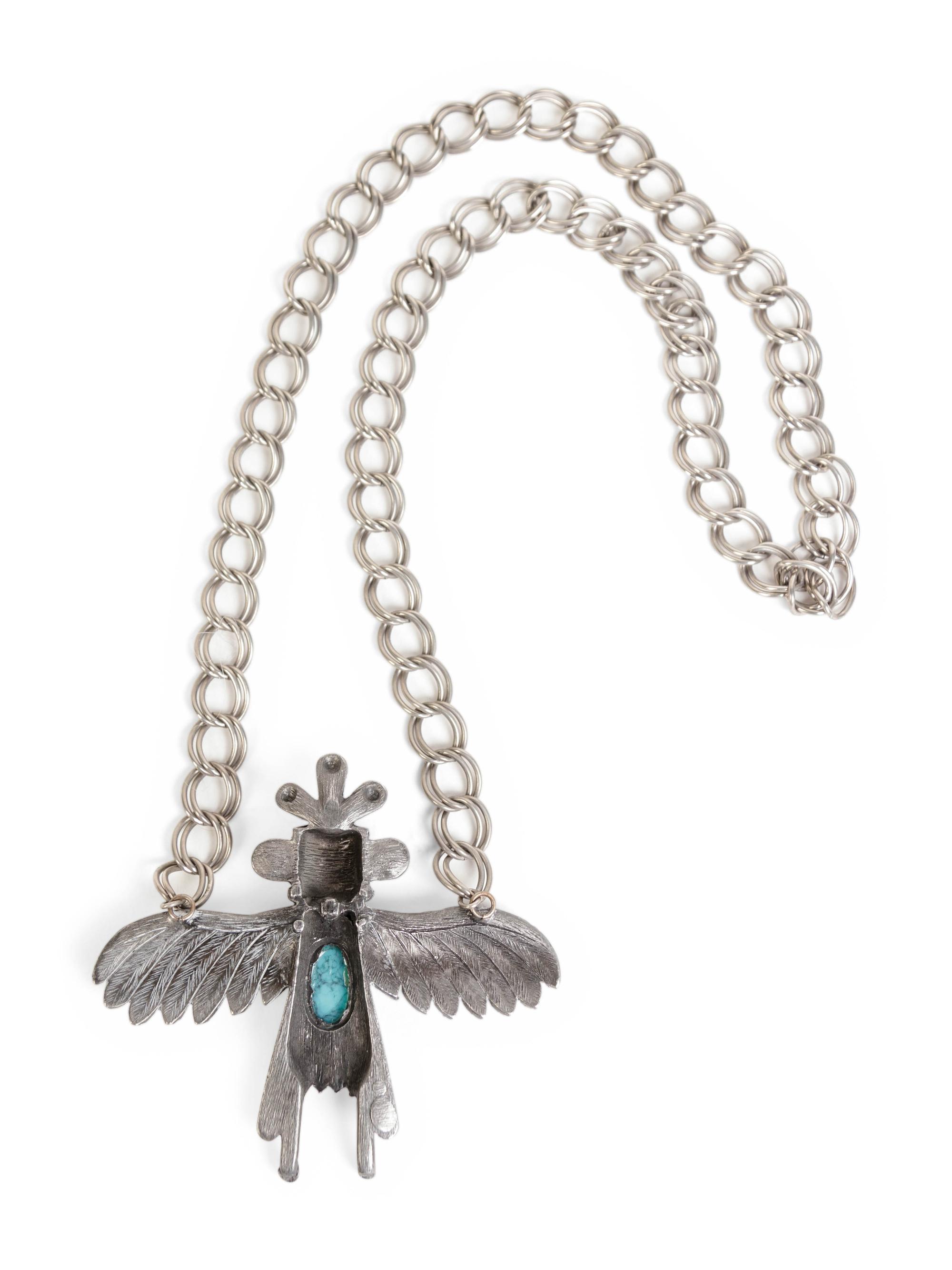 A Silver and Turquoise Pendant