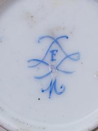 Three Sèvres Painted, Parcel Gilt and "Jeweled" Celeste Blue-Ground Porcelain Teacups and Saucers