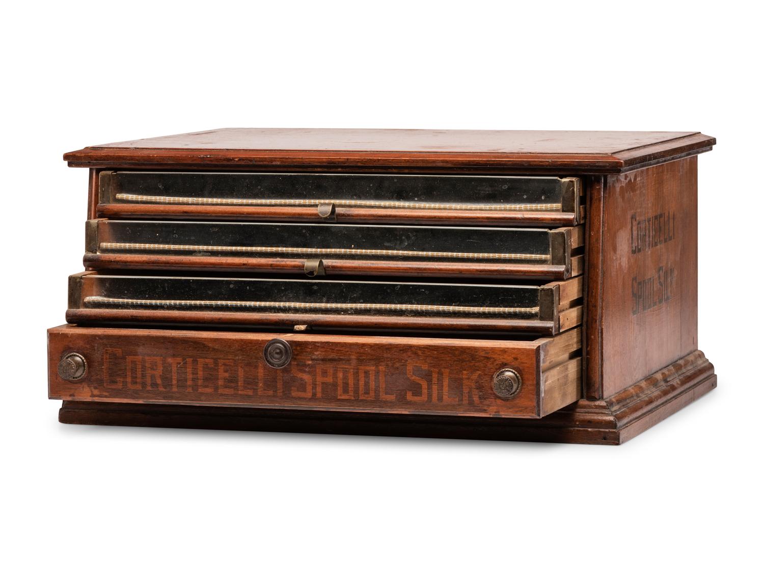 A Corticelli Spool Silk Stenciled Tabletop Spool Cabinet