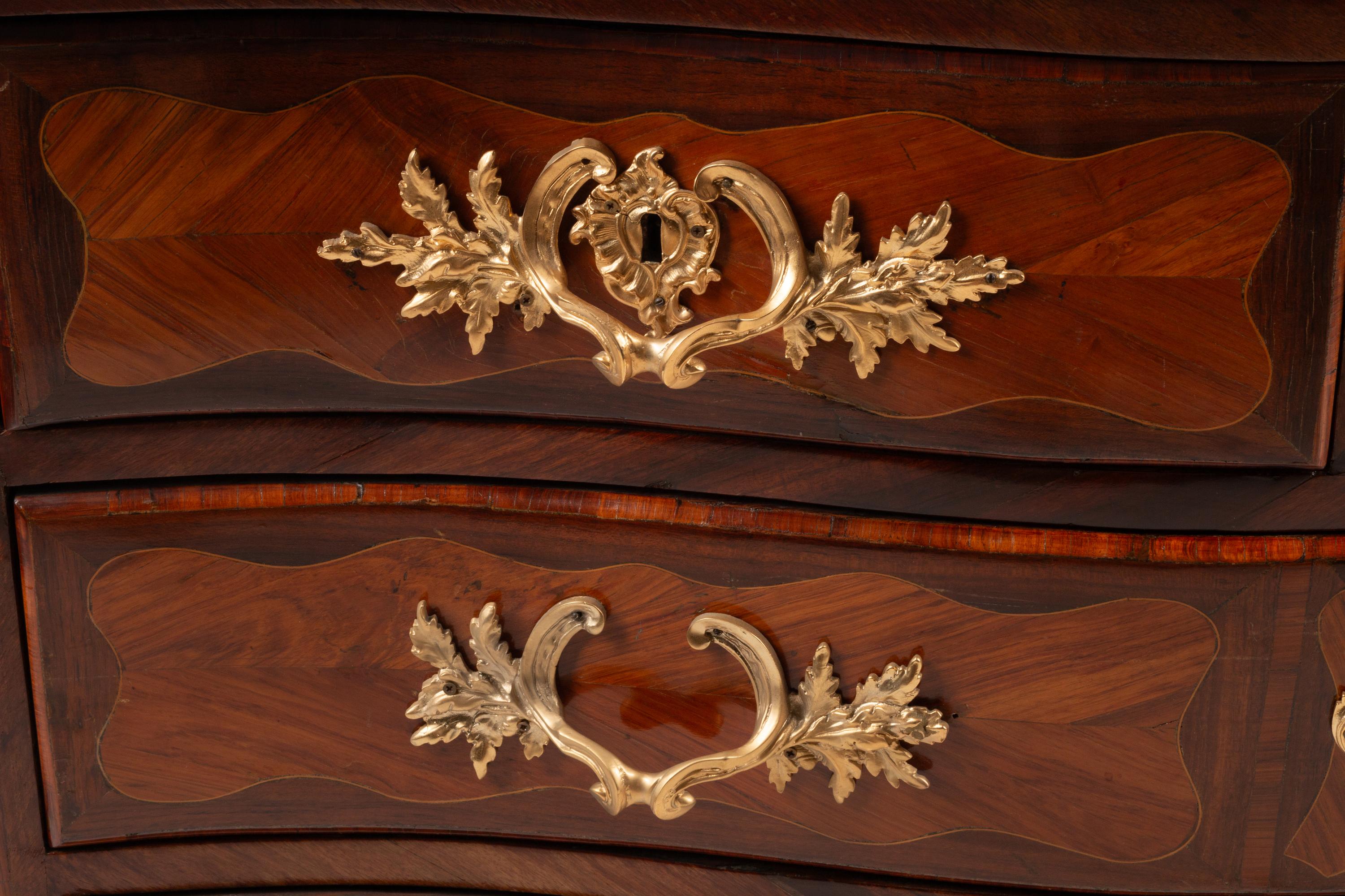 A Régence Gilt Bronze Mounted Kingwood and Tulipwood Parquetry Marble-Top Commode