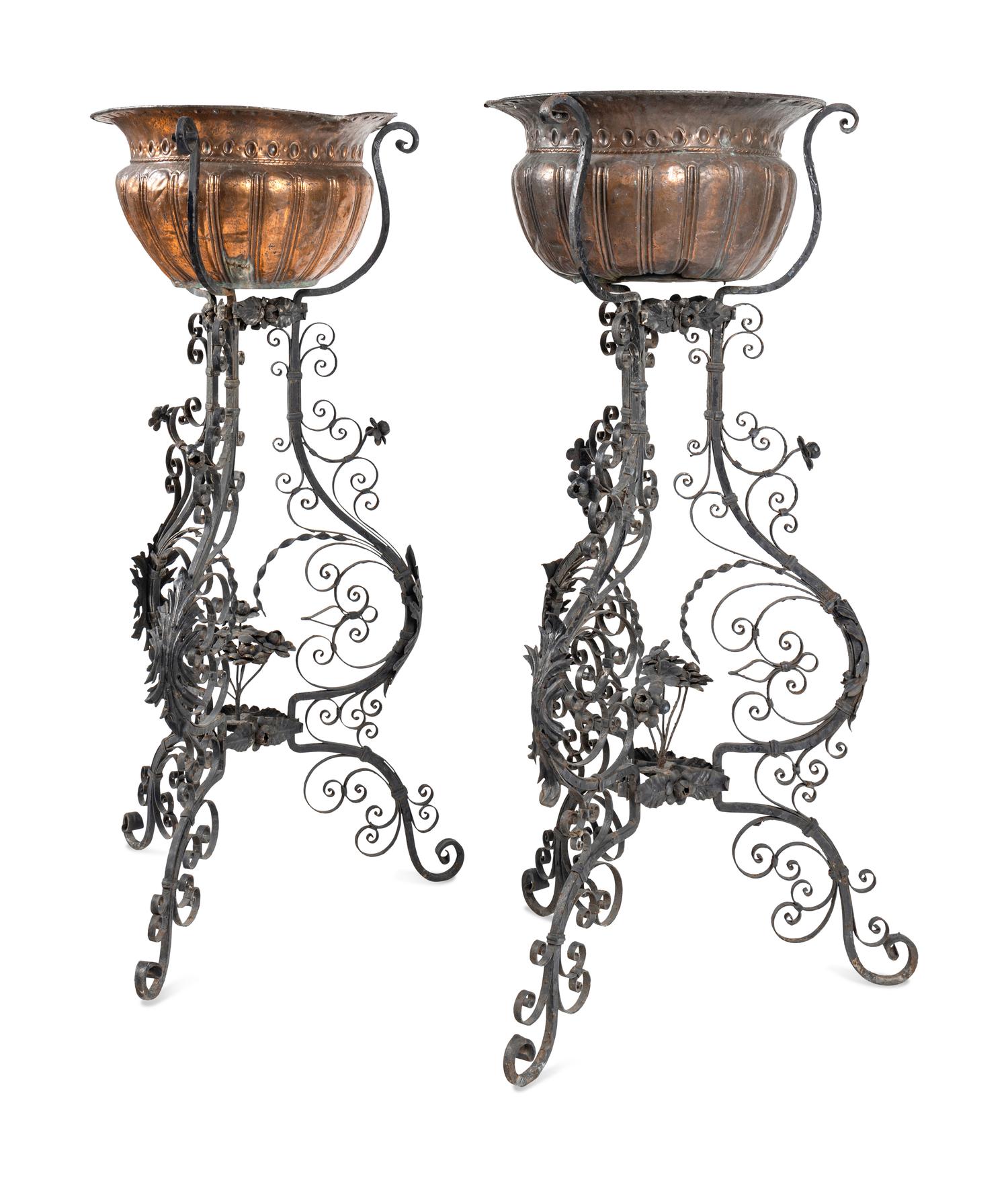 A Pair of Copper Jardinières on Black-Painted Wrought Metal Stands
