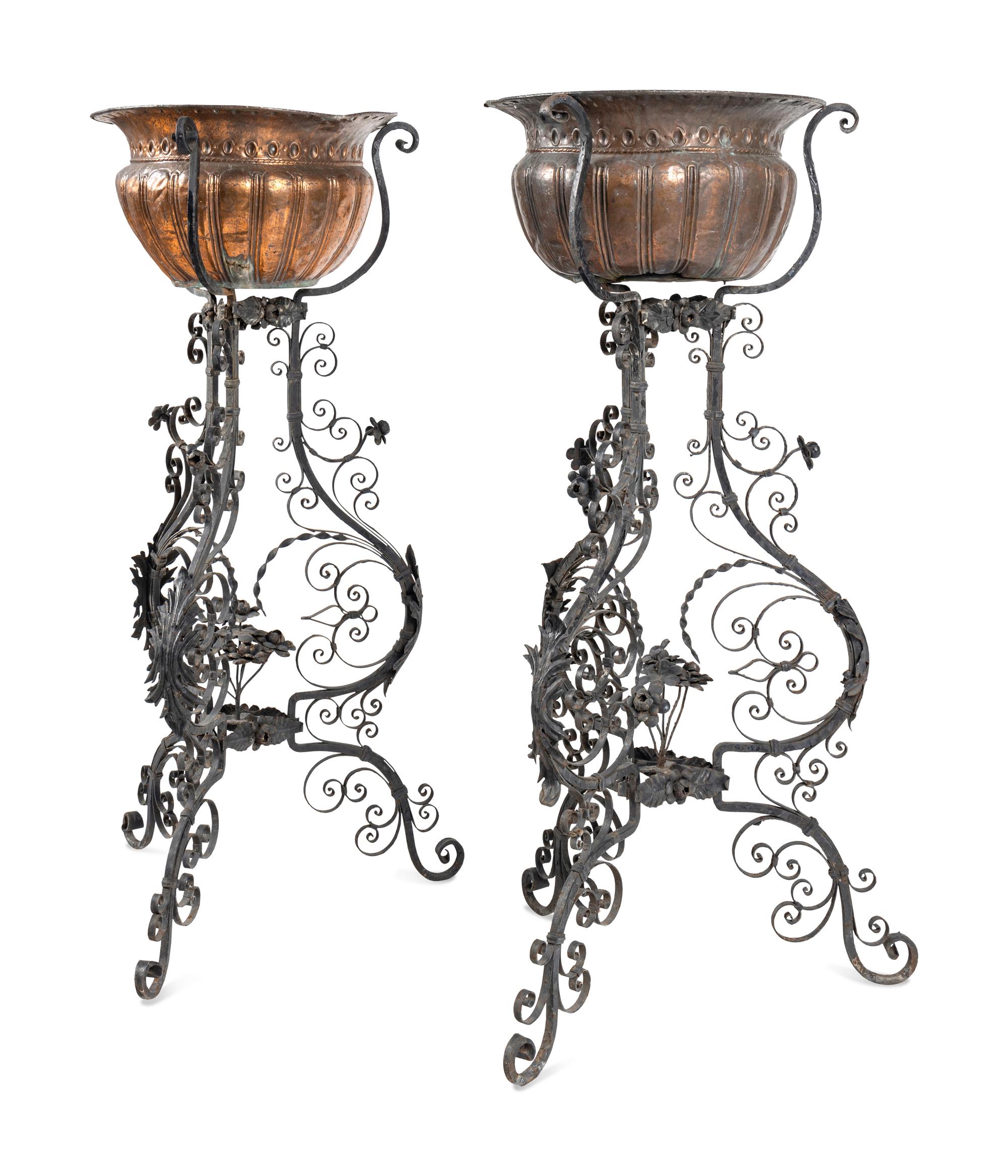A Pair of Copper Jardinières on Black-Painted Wrought Metal Stands