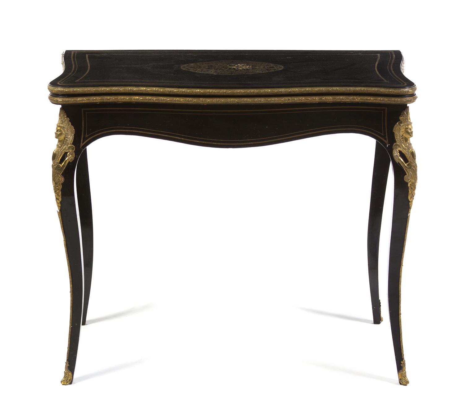 A Napoleon III Ebonized and Gilt Metal Mounted Games Table, Height 29 x width 33 x depth 16 5/8 inches (closed).