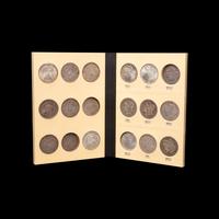 A Collection of Seventy Morgan Silver Dollars