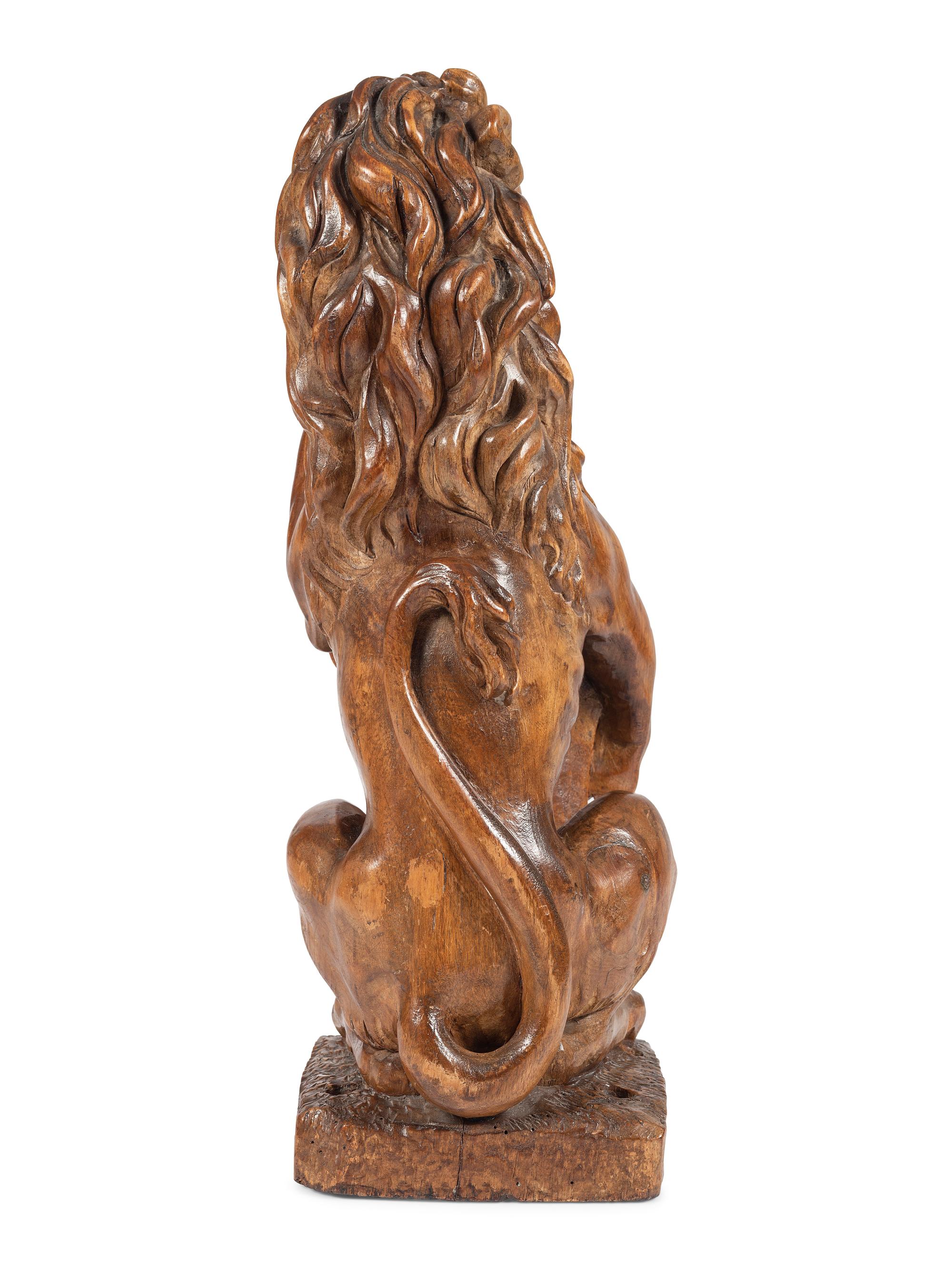 A Carved Wood Lion Newel Post Figure