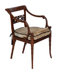 A Set of Four Regency Style Mahogany Cane Seat Dining Chairs