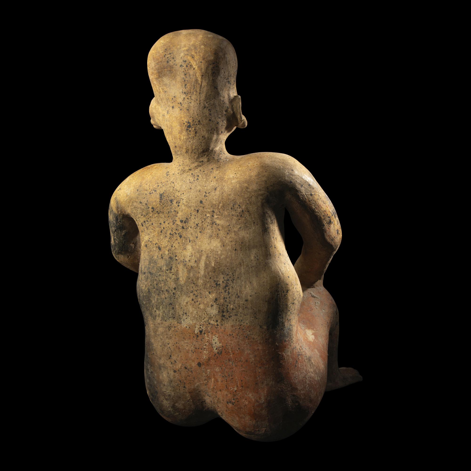 A Jalisco Terracotta Seated Male Figure