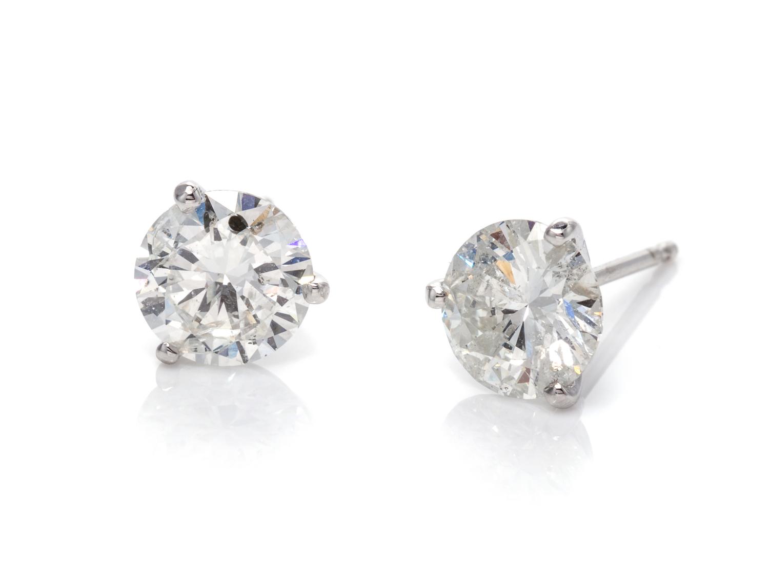 A Pair of 14 Karat White Gold and Diamond Stud Earrings,