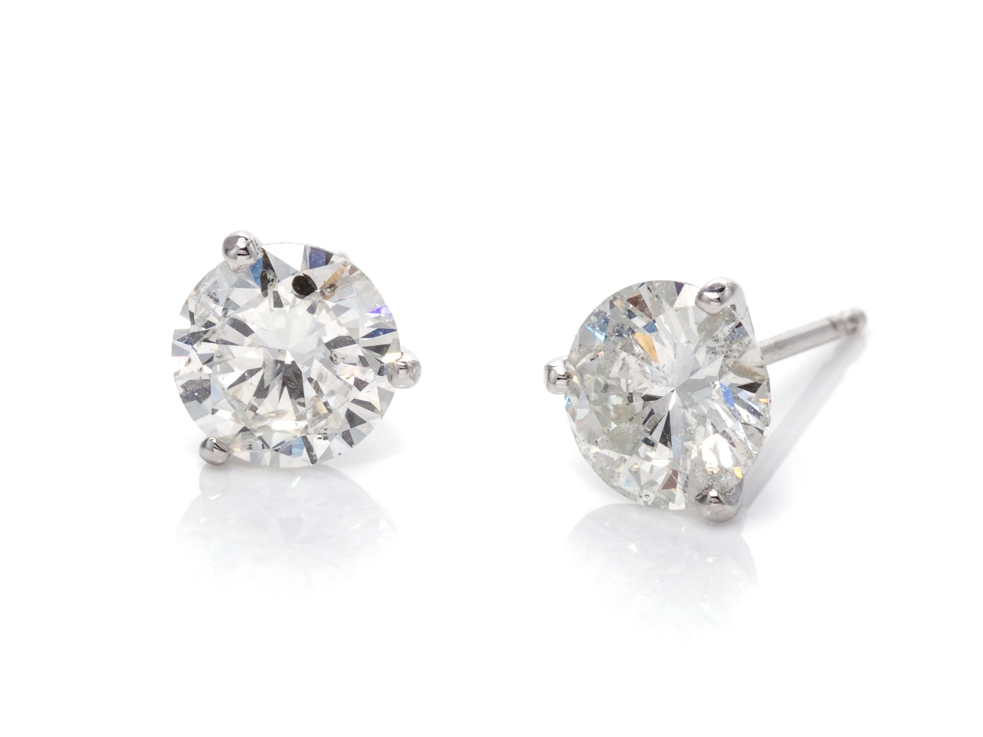 A Pair of 14 Karat White Gold and Diamond Stud Earrings,