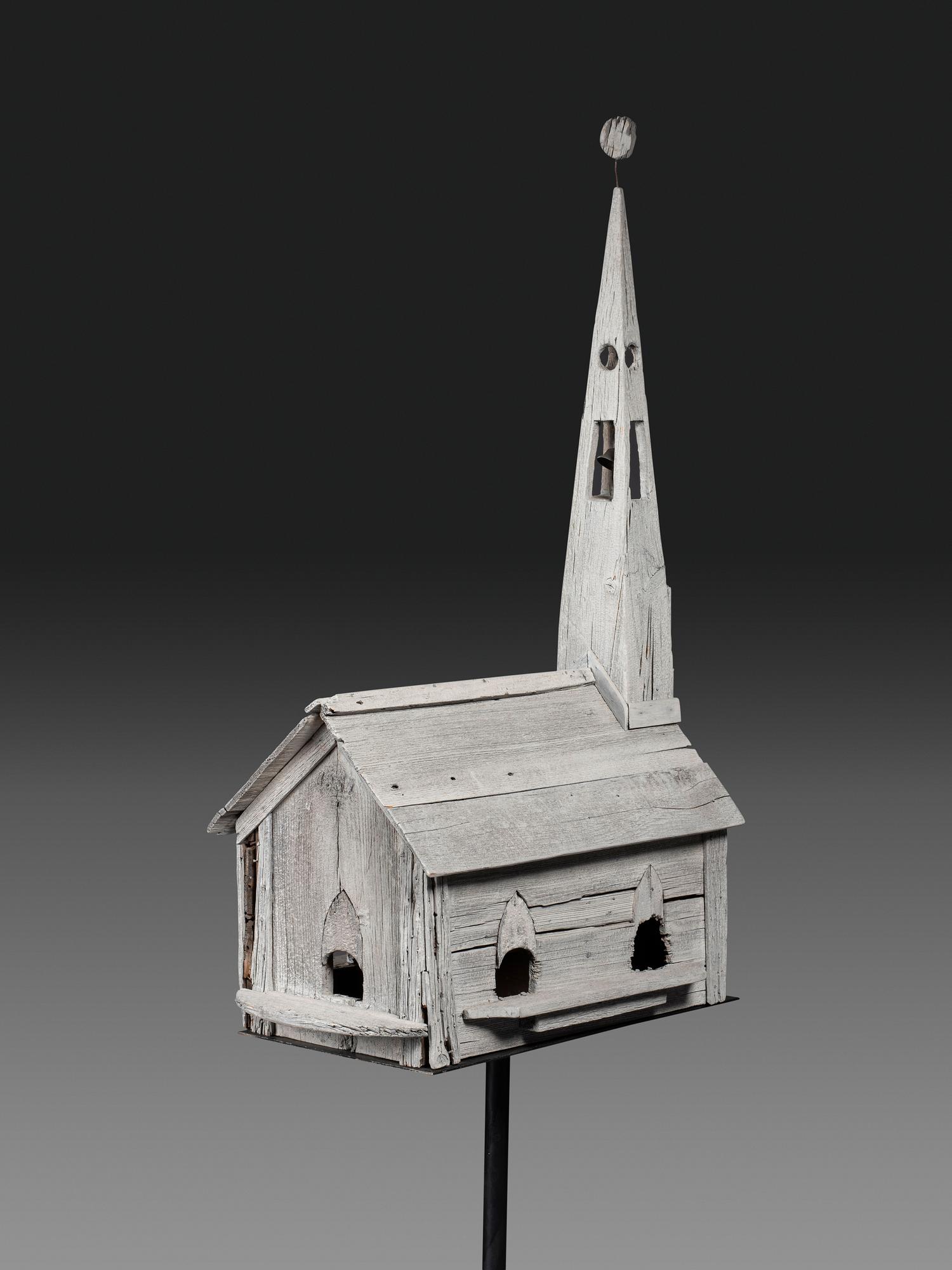 A Carved Wood Church Form Bird House on Stand