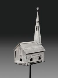 A Carved Wood Church Form Bird House on Stand