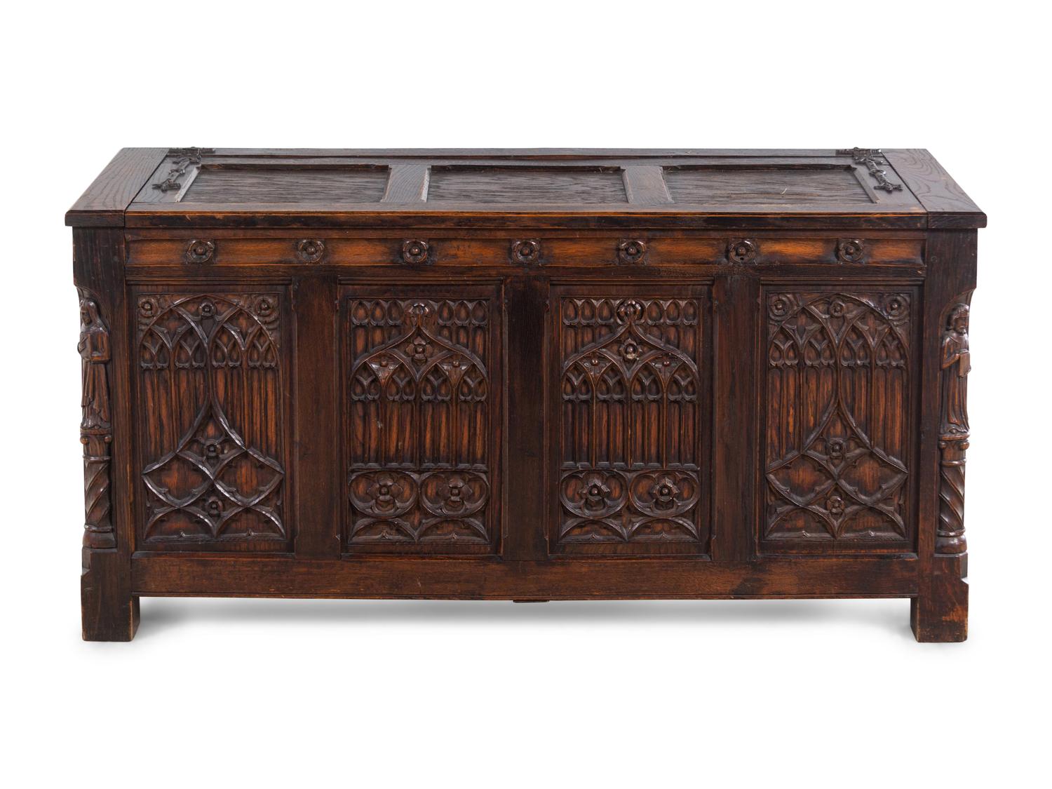 A Gothic Revival Carved Oak Chest