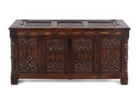 A Gothic Revival Carved Oak Chest