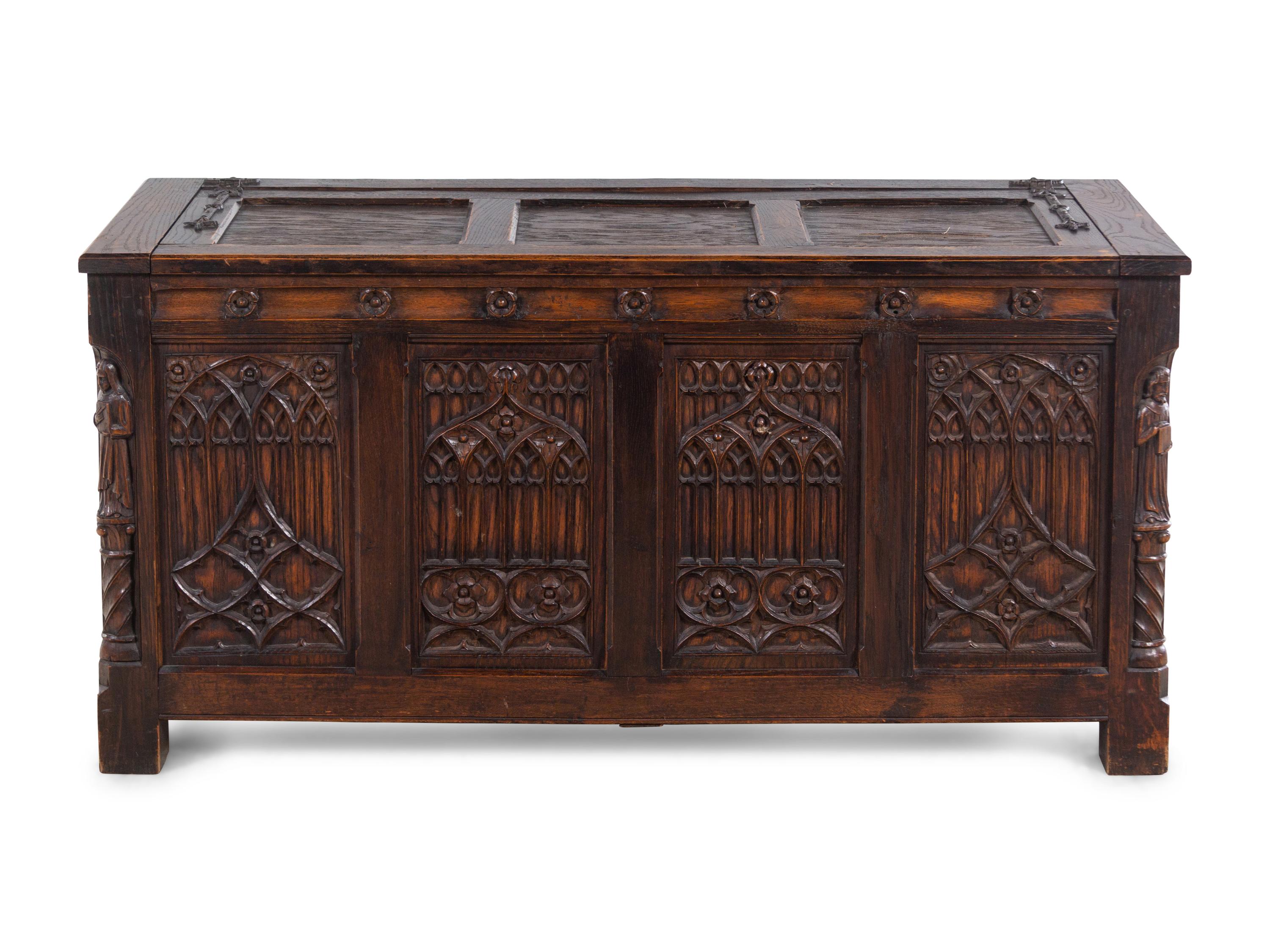 A Gothic Revival Carved Oak Chest