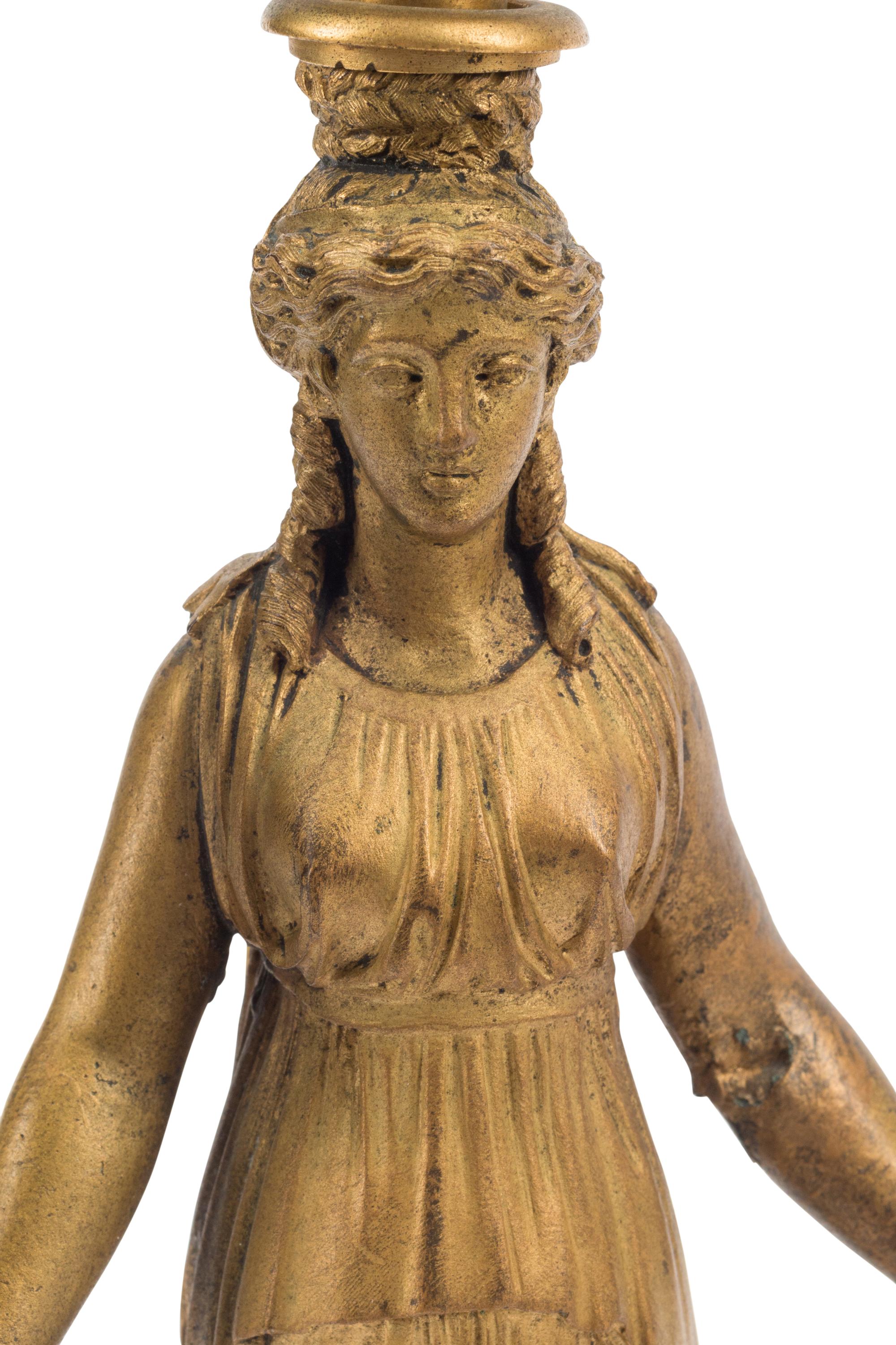A Pair of Empire Style Gilt Bronze Three-Light Figural Candelabra