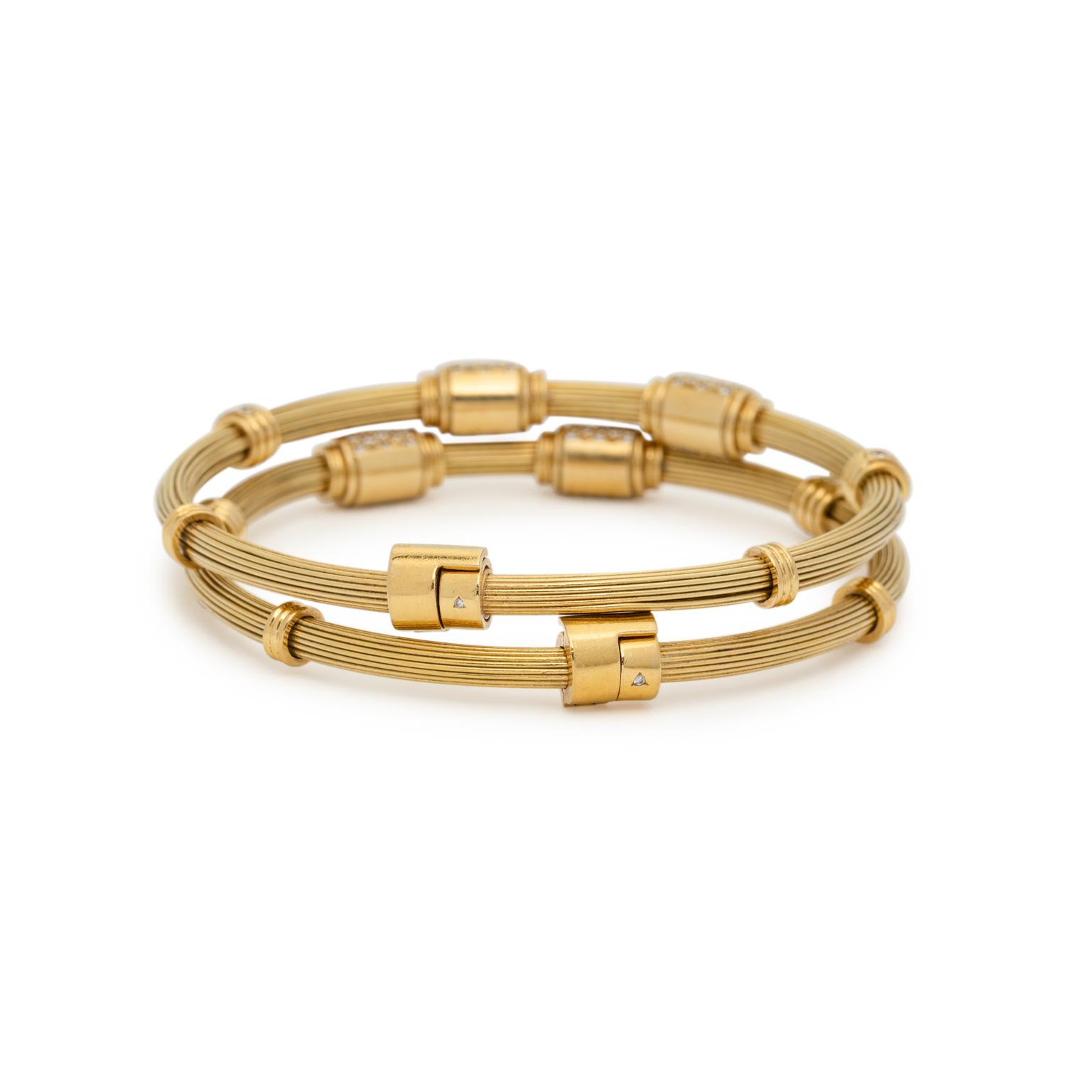 PAIR OF YELLOW GOLD AND DIAMOND BANGLE BRACELETS