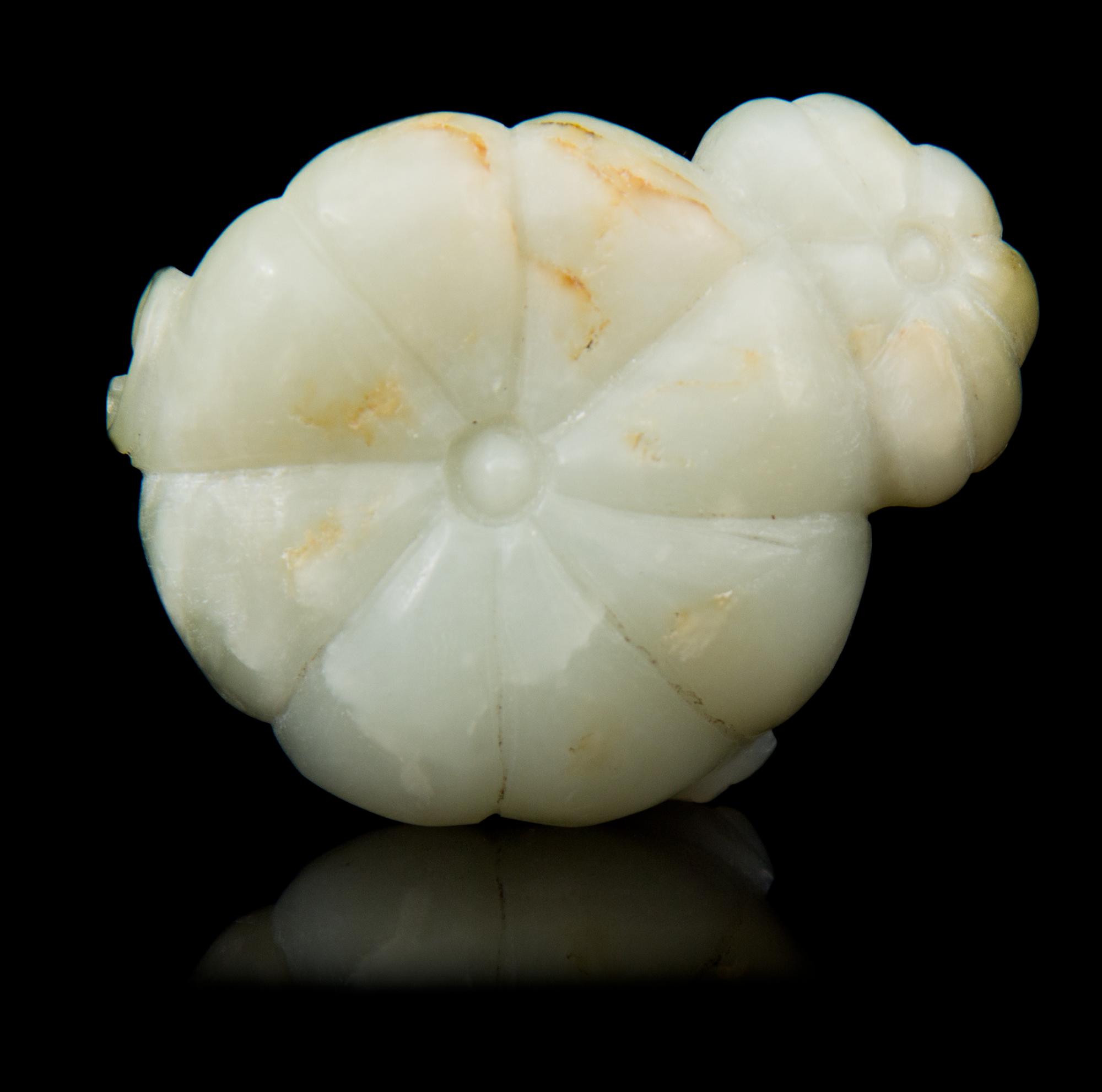 A Carved Jade Toggle Length 2 1/8 inches.